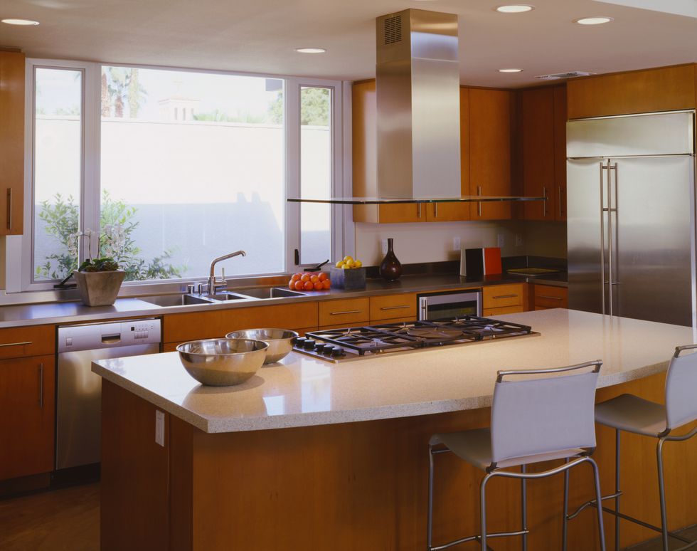 modern kitchen with stove burners mounted on central island