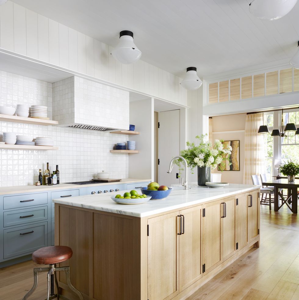 connecticut lakeside home by designer david kleinberg and architect tom kligerman with kitchen with white backsplash