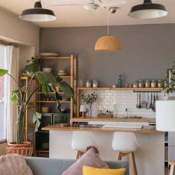 modern open plan kitchen and living room with sofa and island