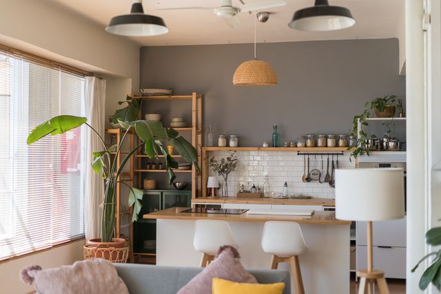 modern open plan kitchen and living room with sofa and island