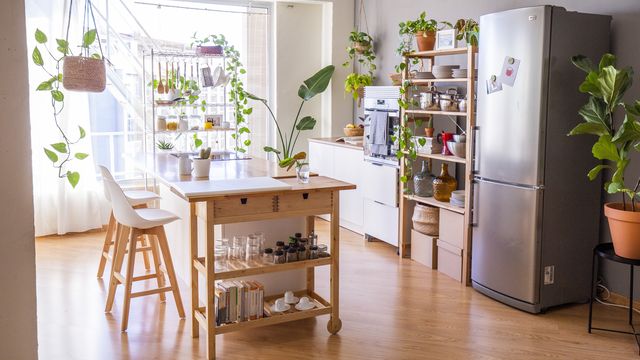 modular kitchen in an open space loft with big window. emergency exit stairs