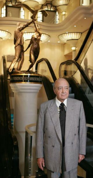 Mohamed Al Fayed with the statue of Princess Diana and Dodi