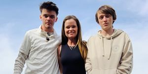 moira clark takes a picture with her two sons