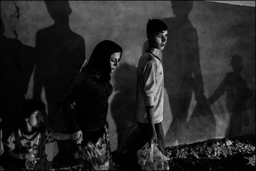 Een familie van ontheemde Yezidis uit Sinjar vlucht voor de komst van de Islamitische Staat in Iraaks Koerdistan