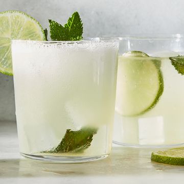 classic mojito with muddled lime and a lime wheel