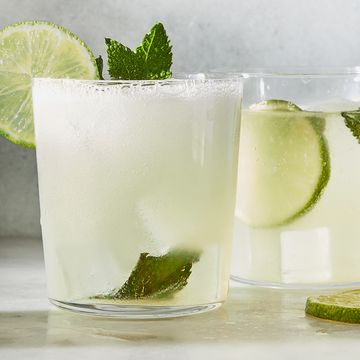 classic mojito with muddled lime and a lime wheel