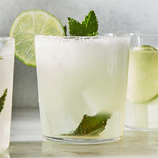 classic mojito with muddled lime and a lime wheel