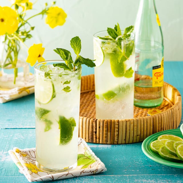 mojito in tall glasses with lime slices and sugar