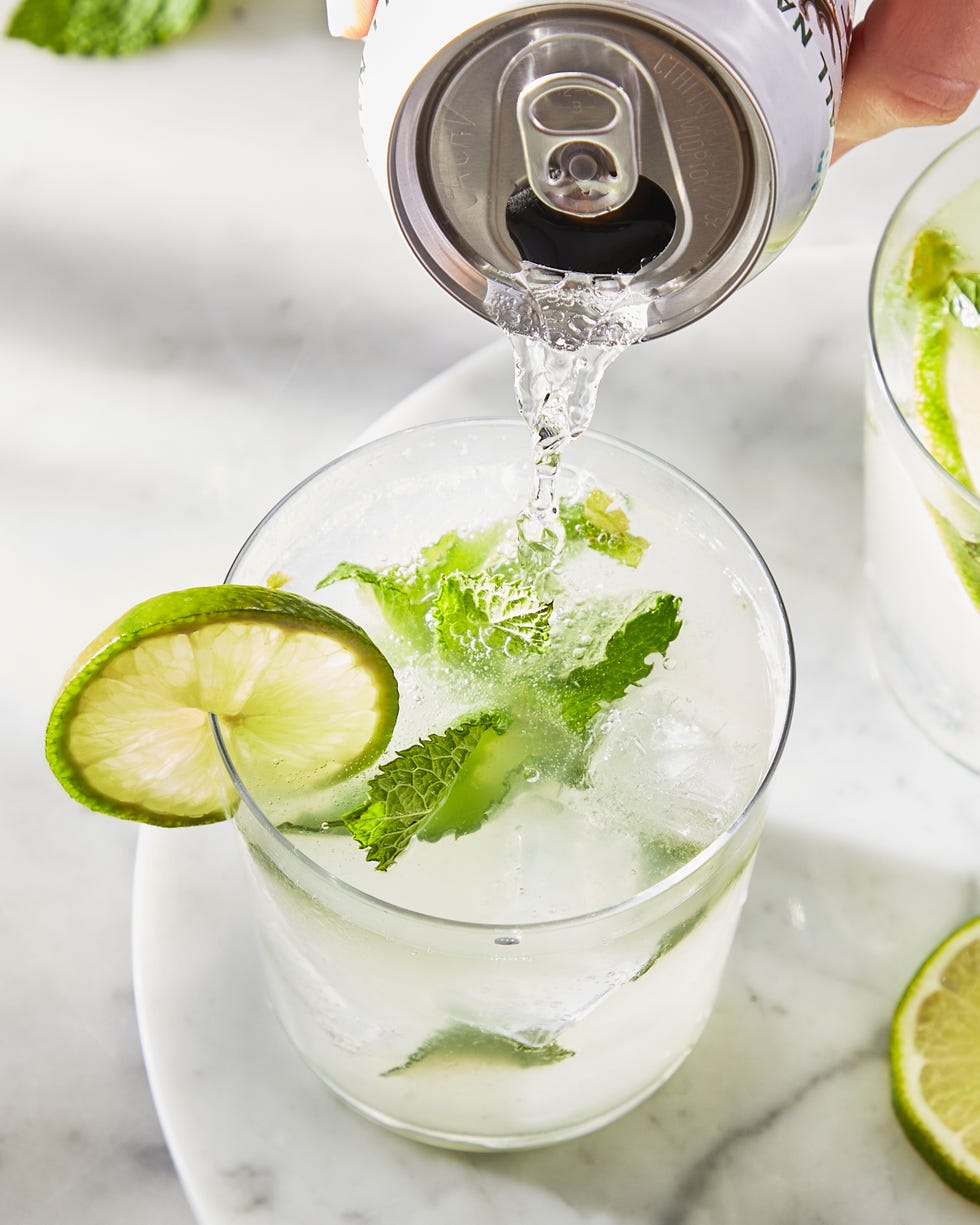 classic mojito with muddled lime and a lime wheel