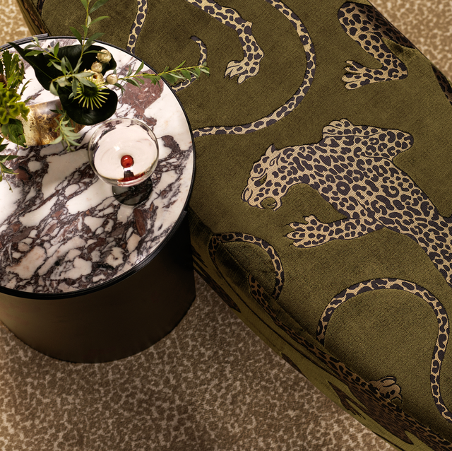 a leopard illustrative textile next to a marble table