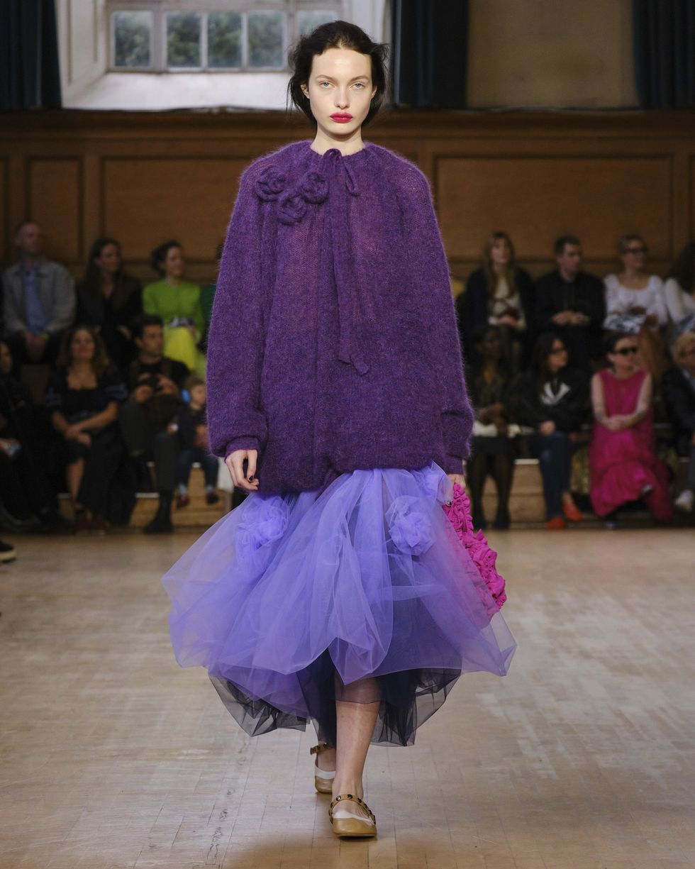 a woman in a purple dress