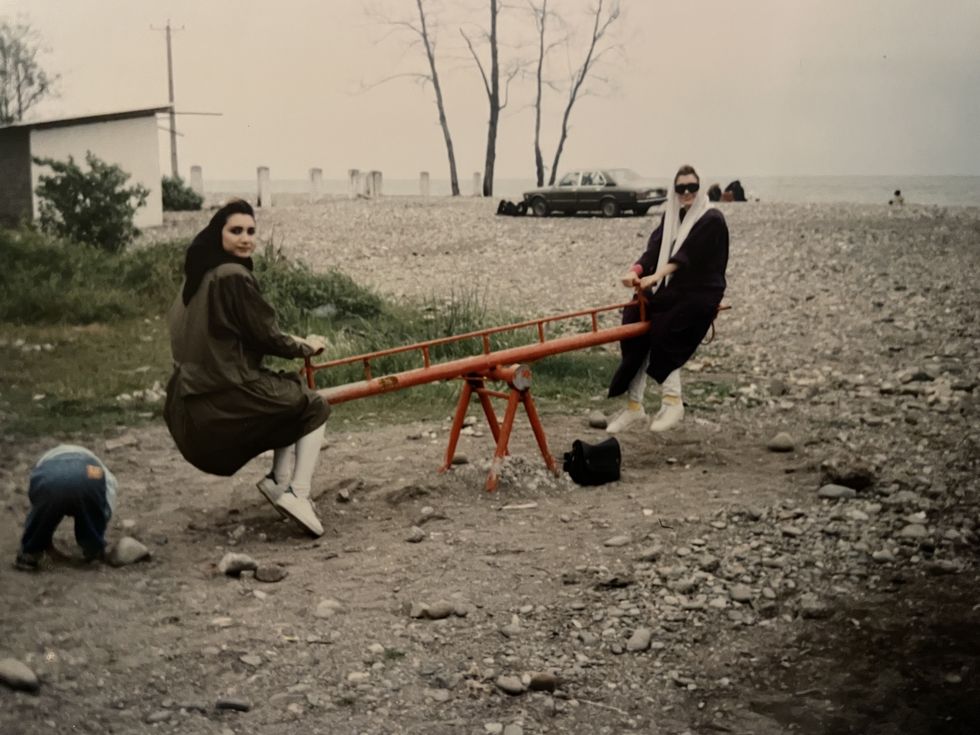 woman and friend on seesaw
