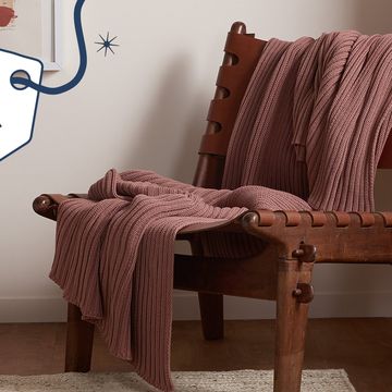 chair with blanket and gift guide badge