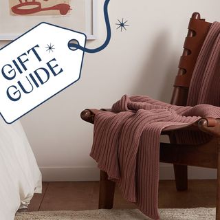 chair with blanket and gift guide badge