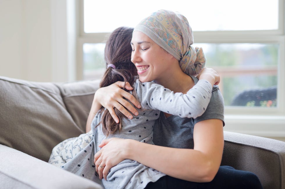mom with cancer holding daughter