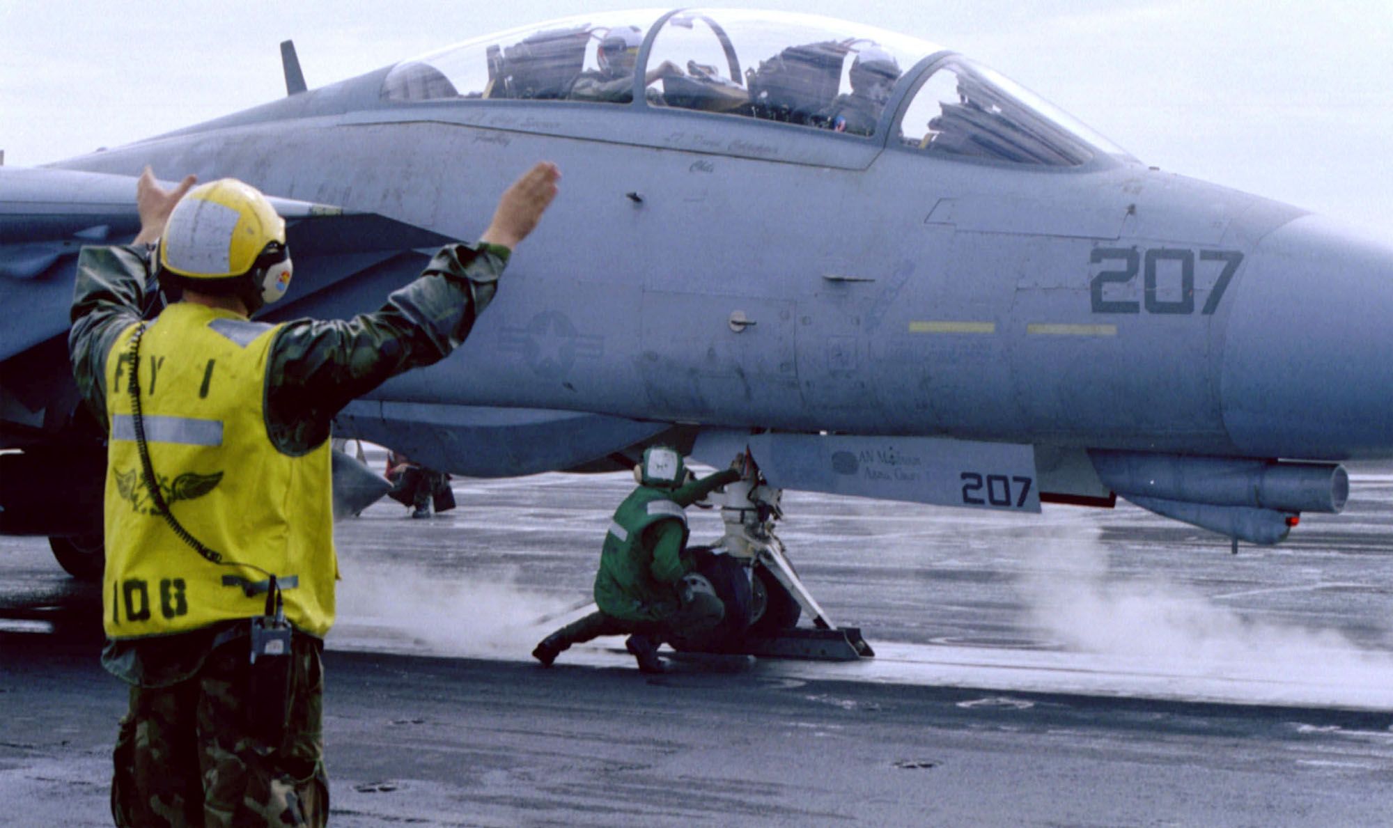 moments-prior-to-launch-a-flight-deck-crewmember-signals-news-photo-1744912725.pjpeg