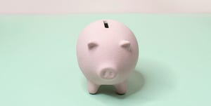 money saving tips   hand putting money in piggy bank