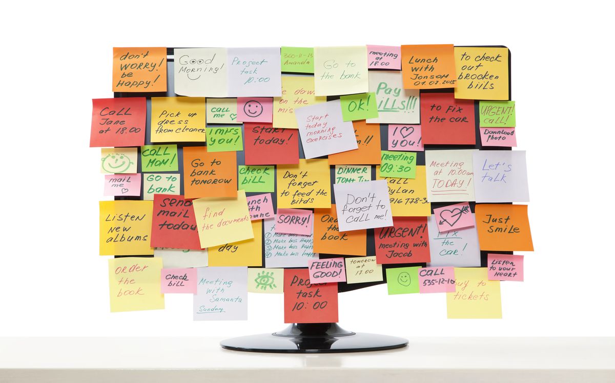 monitor with stickie reminders all over it