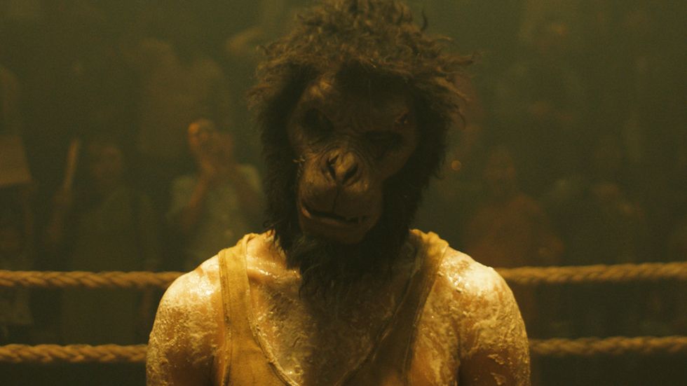 dev patel as kid wearing a monkey mask, monkey man