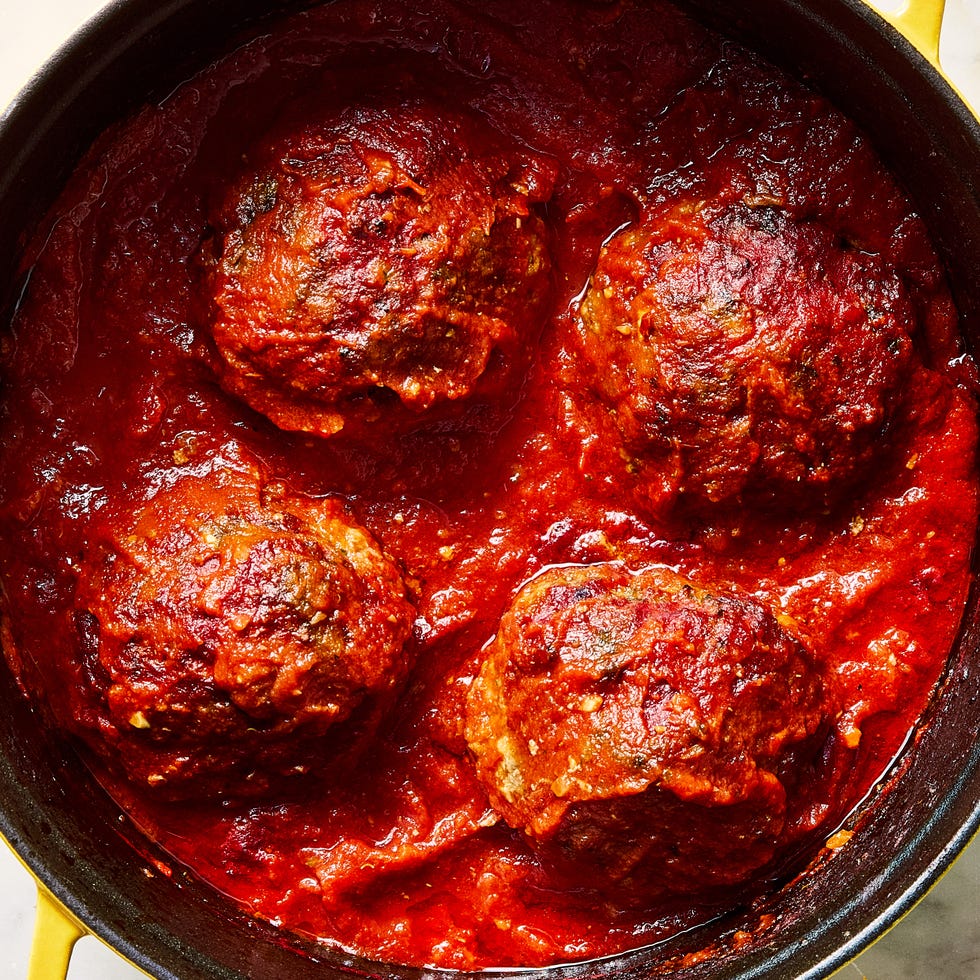 large meatballs covered in red sauce