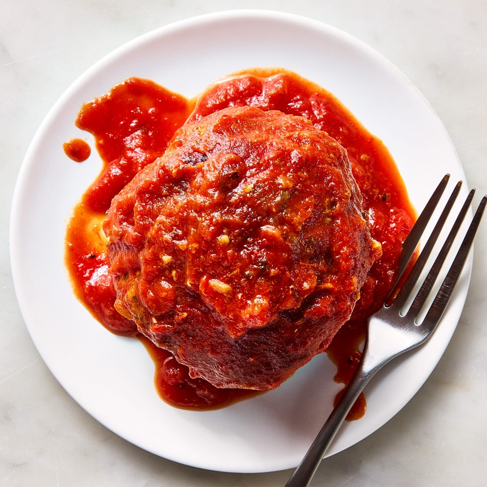 large meatballs covered in red sauce