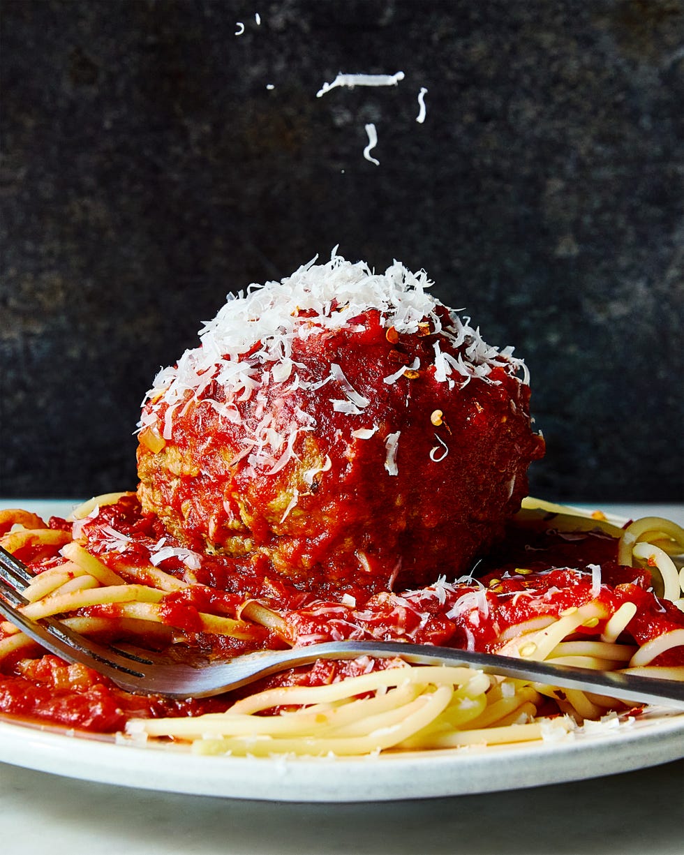 large meatballs covered in red sauce