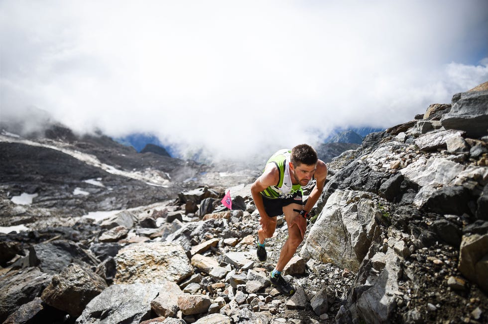 mountain athlete ascending rocky terrain