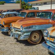 antique rusty cars in a lot, montrose colorado
