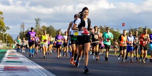 a group of people running on a road