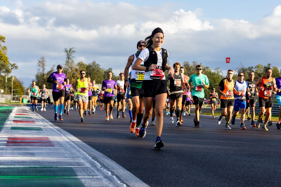a group of people running on a road