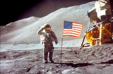 Astronaut David Scott Salutes by U.S. Flag