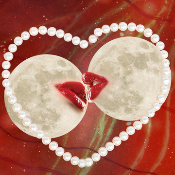 two moons kiss surrounded by a heart shaped string of pearls