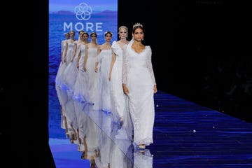 a group of people in white dresses