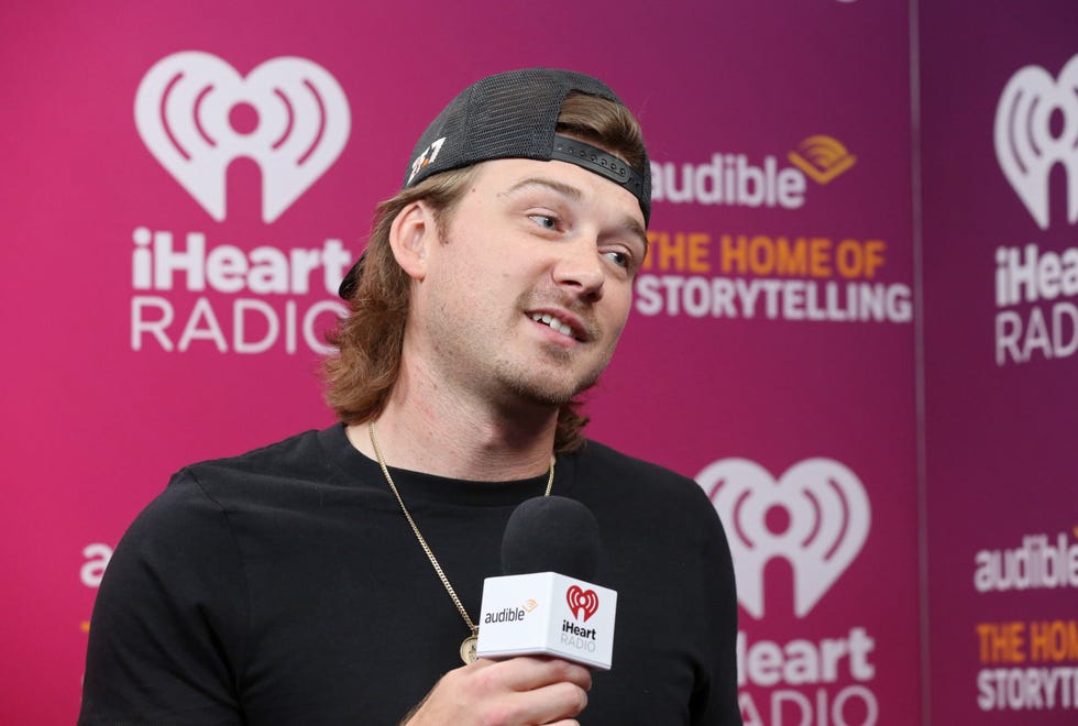 morgan wallen holding a microphone