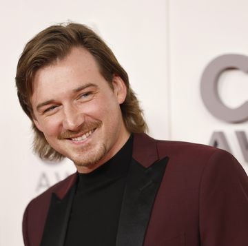 morgan wallen smiling for a photo at an awards event