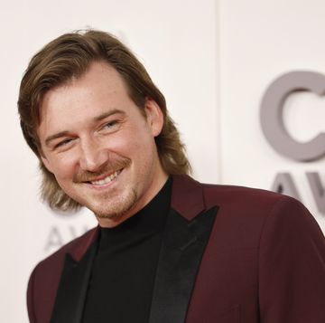 morgan wallen smiling for a photo at an awards event