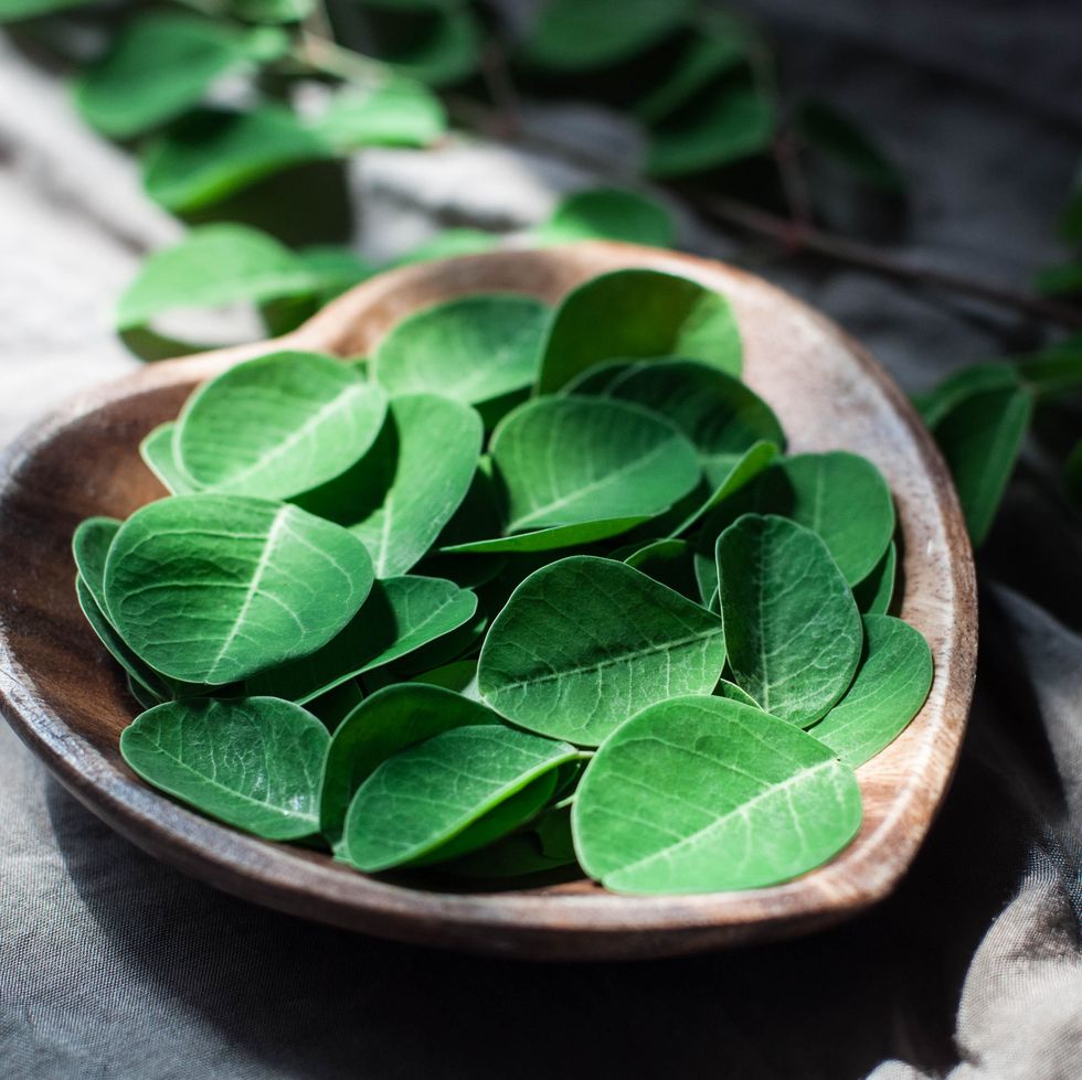 moringa leaves on a heart shaped bowl