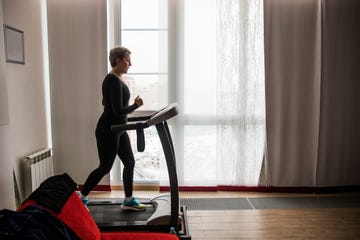 woman working out on treadmill in home