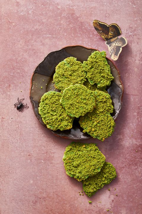 green cookies that resemble moss, served on a black plate