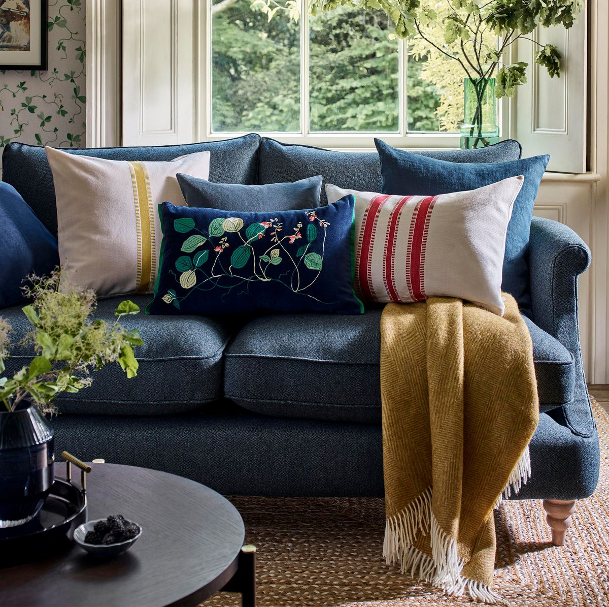 Royal blue throw pillows and dark grey couch
