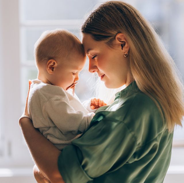 embracing motherhood: mother and baby share a moment of love