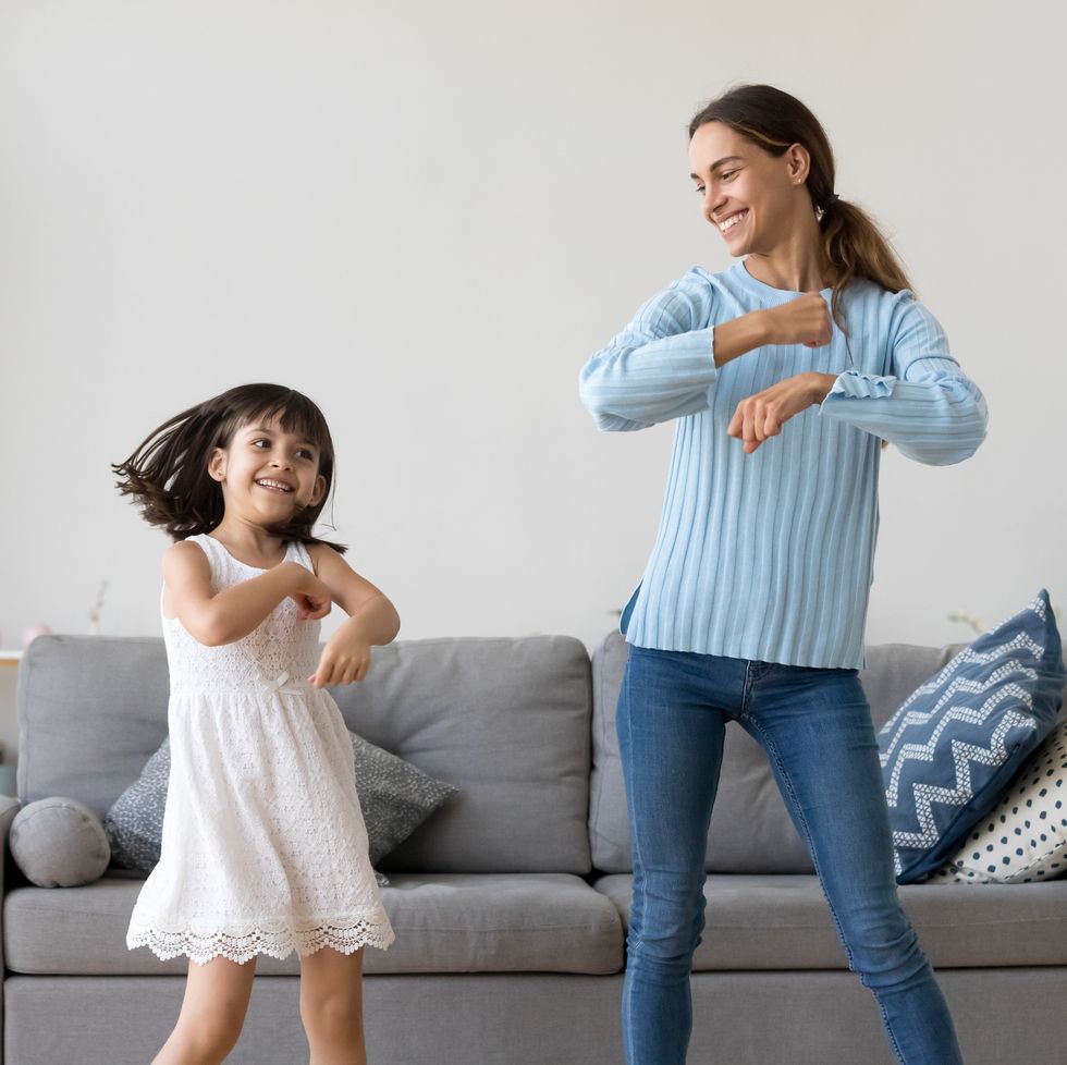 https://hips.hearstapps.com/hmg-prod/images/mother-and-daughter-dancing-together-in-living-room-royalty-free-image-1588190015.jpg?crop=0.668xw:1.00xh;0.180xw,0&resize=980:*