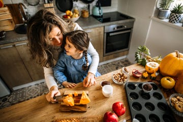 mother and daughter preparing different sweet holiday treats