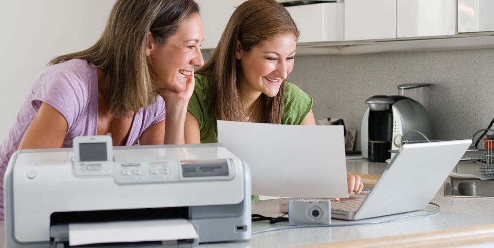 Mother and daughter printing from digital camera