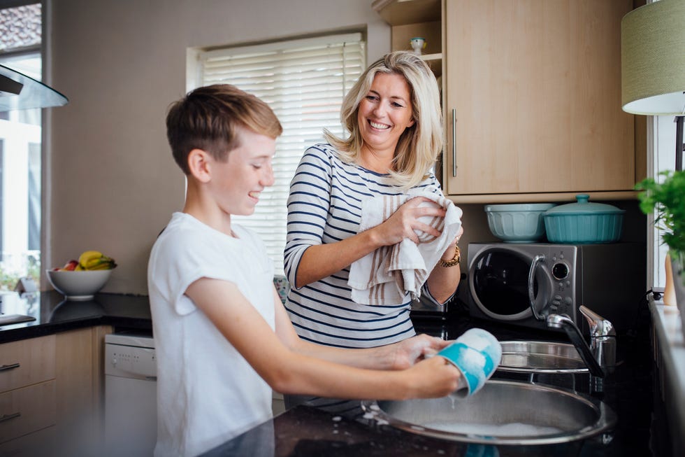 mother and son doing the dishes