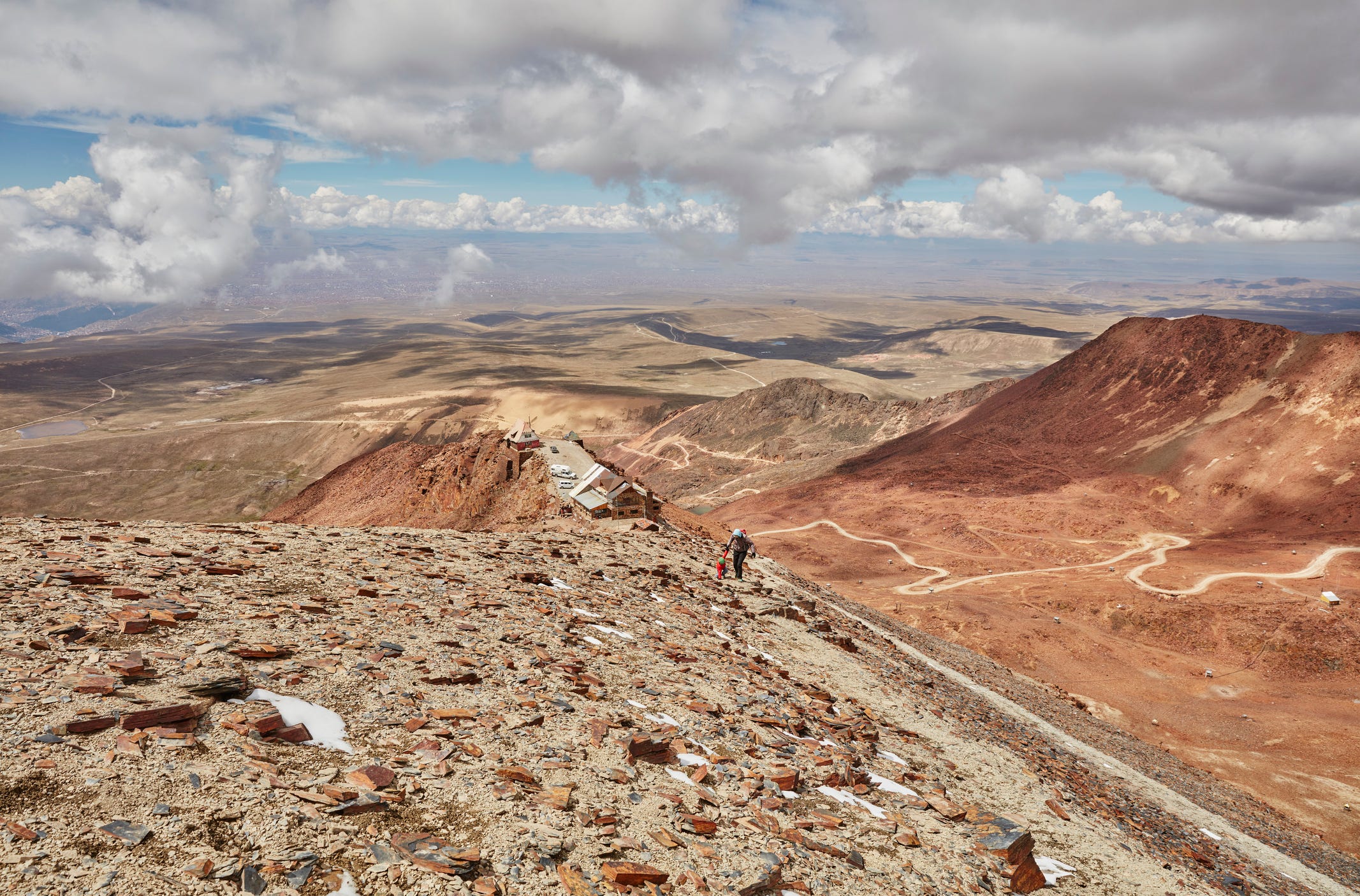 mother and son, trekking across landscape, chacaltaya, la paz, bolivia, south america