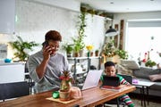 jobs for stay at home moms - Mother looking after son and working from home
