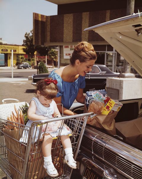 vintage photos of grocery stores   mother loading groceries