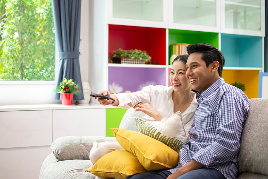 couple watching tv watching home movies is a gh pick for best mother's day activities