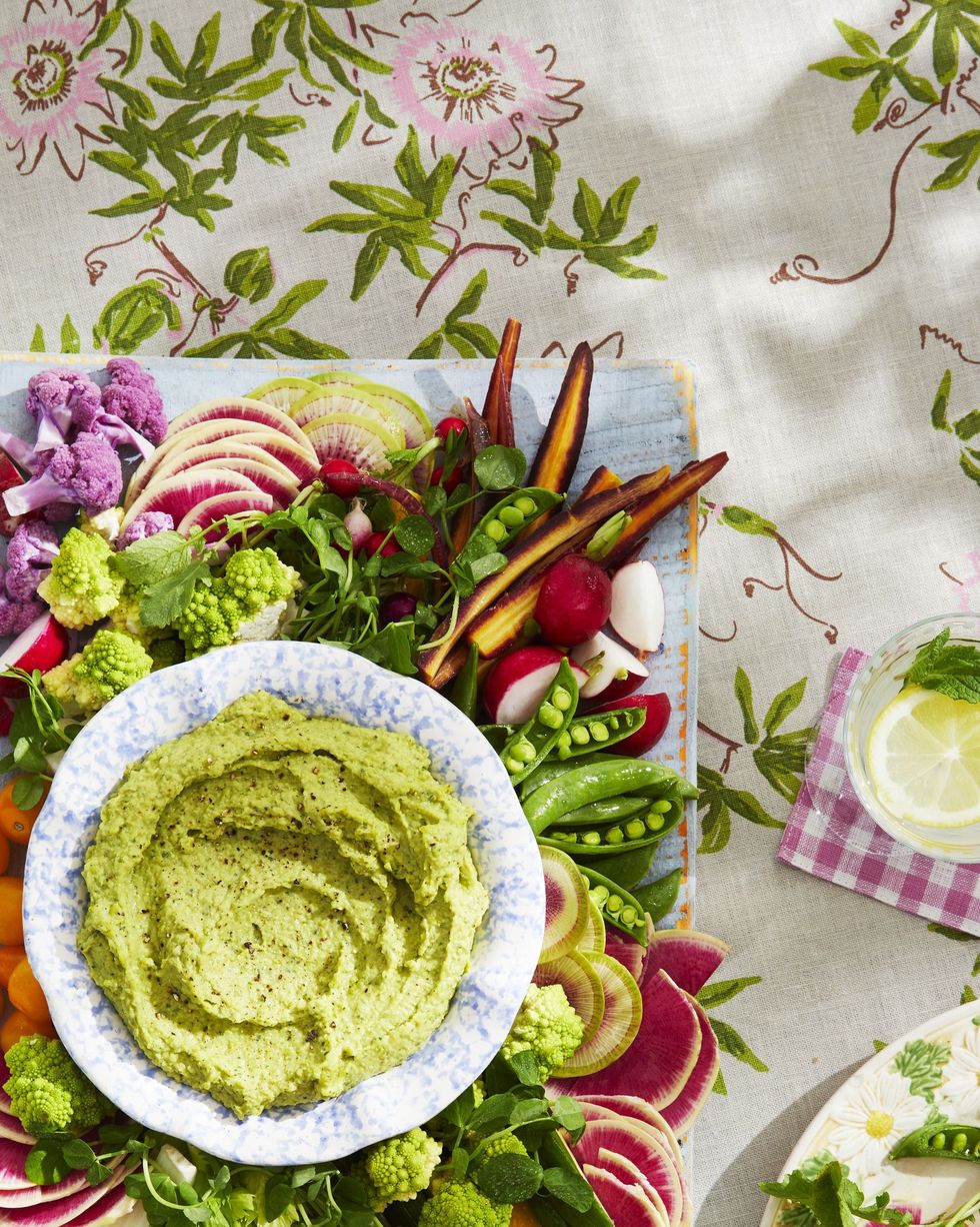 spring crudités board with white bean and pea dip